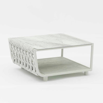 Outdoor furniture from the Lawson Collection, including a white marble-top outdoor coffee table.