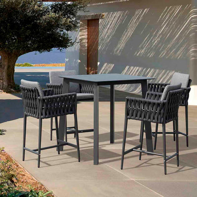 Four rope bar chairs paired with a matching square bar table, set outdoors on a sunny summer day, showcasing stylish alfresco furniture.