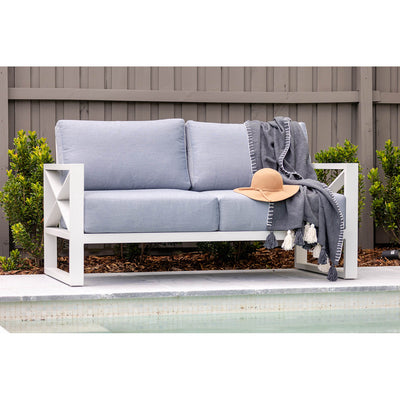 Outdoor furniture collection including aluminum outdoor lounge chair, two-seater, and three-seater sofas in white or charcoal, next to a swimming pool.