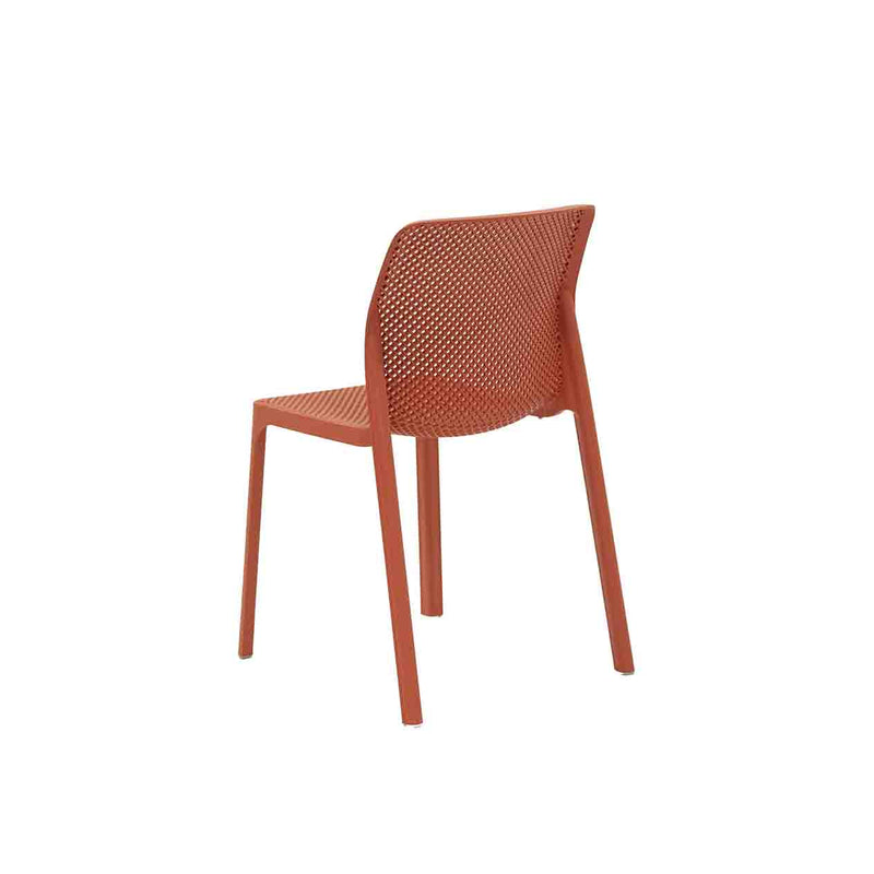 Red Resin Nardi Bit Outdoor Dining Chair displayed on a plain white background, viewed from a back angle.