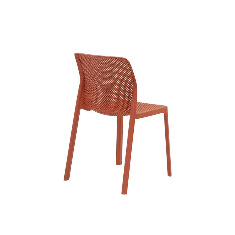 Red Resin Nardi Bit Outdoor Dining Chair displayed on a plain white background, viewed from a back angle.