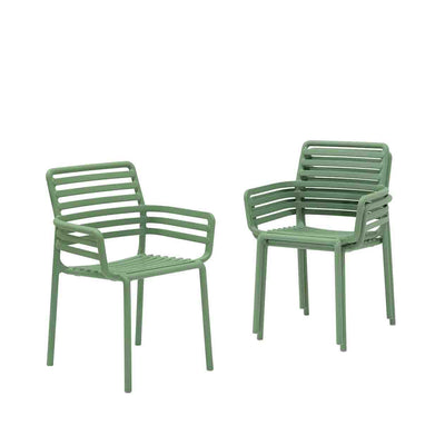 Three Light Green Resin Nardi Doga Outdoor Dining Chairs (with arms) displayed against a plain white background. Two are stacked on top of each other, while the other is by itself.