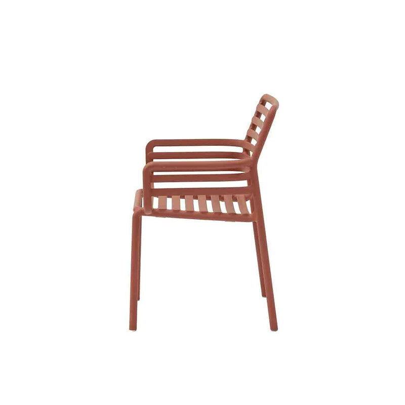 Red Resin Nardi Doga Outdoor Dining Chair (with arms) displayed on a plain white background, viewed from the side.