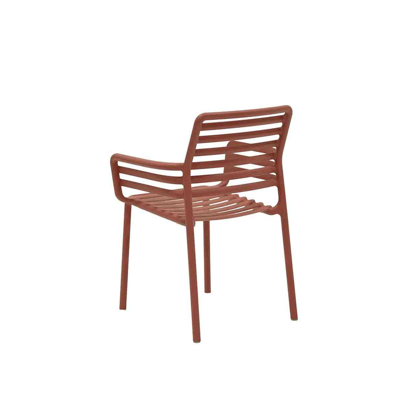 Red Resin Nardi Doga Outdoor Dining Chair (with arms) displayed on a plain white background, viewed from a back angle.