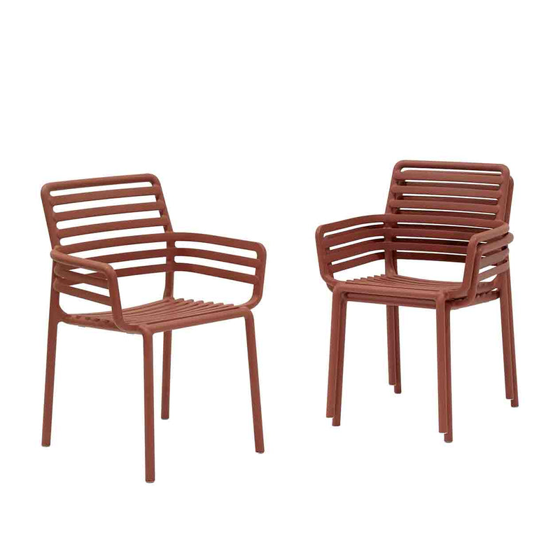 Three Red Resin Nardi Doga Outdoor Dining Chairs (with arms) displayed against a plain white background. Two are stacked on top of each other, while the other is by itself.