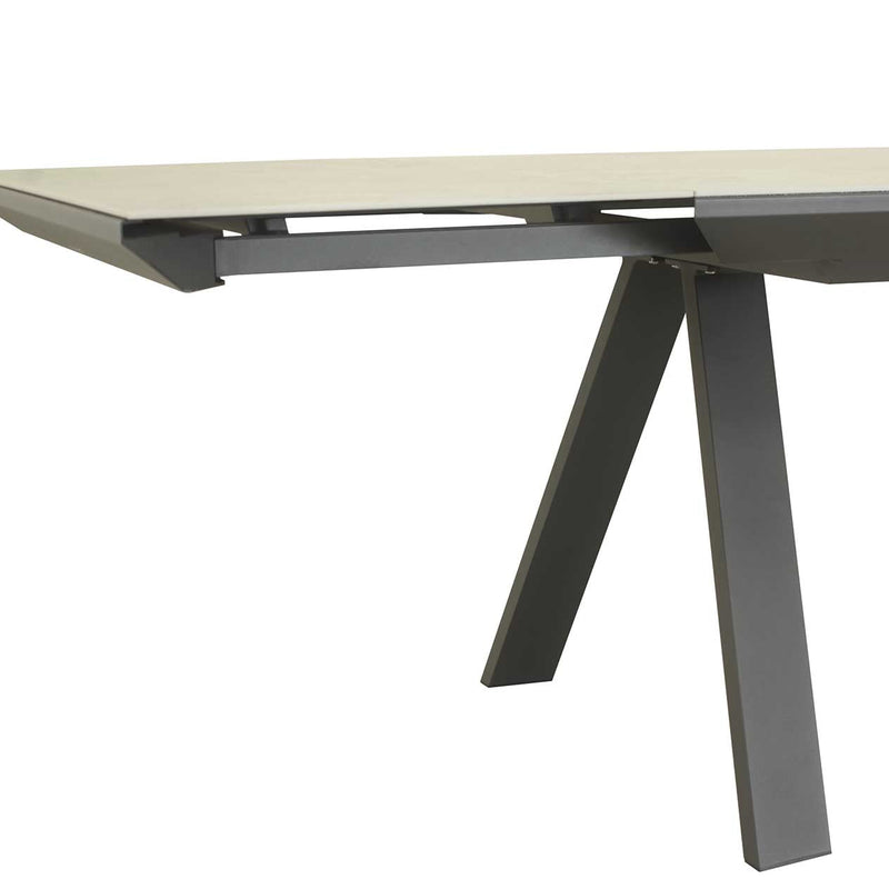 Close-up on the aluminium frame of a brown, rectangular Neverland extendable outdoor table, perfect for alfresco furniture setups, displayed on a plain white background.