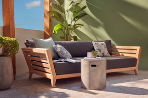 Outdoor balcony furniture set from The Ottawa family, featuring outdoor chairs, a 3-seater outdoor lounge, and a daybed on a patio with a couch, table, and potted plants.