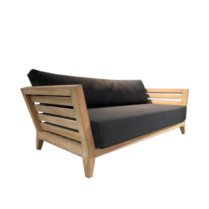 Outdoor balcony furniture set from The Ottawa family, featuring outdoor chairs, a 3-seater outdoor lounge, and a daybed, all made of durable teak wood with black Sunproof® cushions, as seen in the current image of a wooden couch with a black cushion on it.