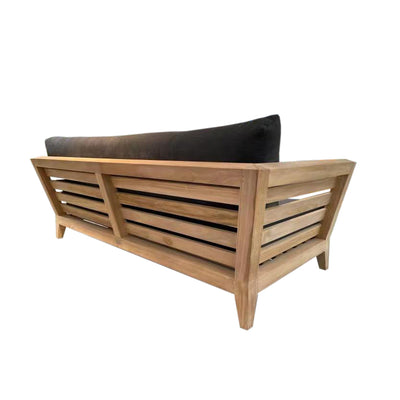Outdoor balcony furniture set from The Ottawa family, featuring outdoor chairs, a 3-seater outdoor lounge, and a daybed, all made of durable teak wood and Sunproof® fabric, similar to a wooden bench with a black cushion on it.