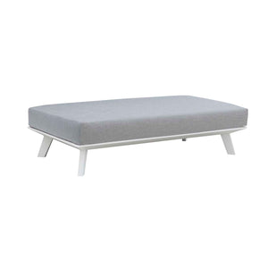 Positano aluminum outdoor furniture range featuring outdoor chairs, outdoor lounge, ottoman, and daybed in charcoal and white with grey cushions. A white bench with a grey cushion on it.