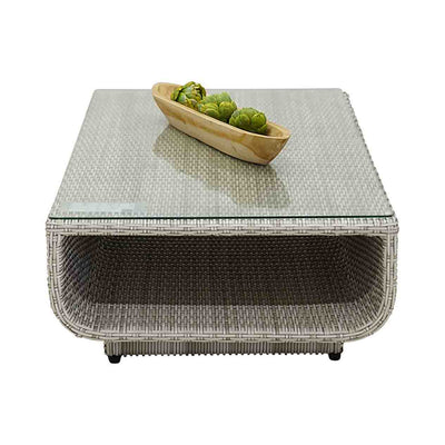 Rossland outdoor lounge collection featuring a wicker lounge chair, 2-seater, 3-seater, 4-seater and 5-seater sofas on a bowl of hops on a glass top white wicker coffee table.