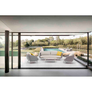 Sorrento 5-seater outdoor lounge setting with yellow pillows on each seat and a matching coffee table, set poolside in a modern outdoor area, showcasing vibrant alfresco furniture.
