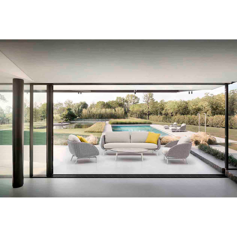 Sorrento 5-seater outdoor lounge setting with yellow pillows on each seat and a matching coffee table, set poolside in a modern outdoor area, showcasing vibrant alfresco furniture.
