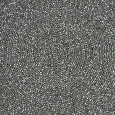 Close-up of a dark-grey rug, displaying the intricate circular design, designed for outdoor furniture areas.