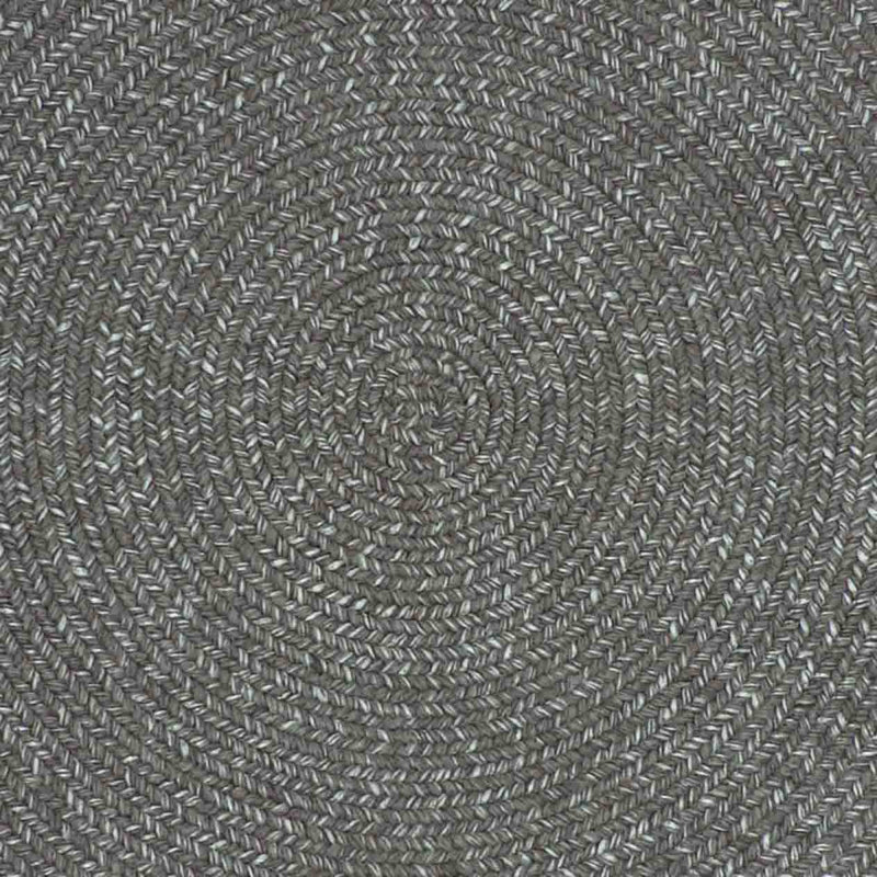 Close-up of a dark-grey rug, displaying the intricate circular design, designed for outdoor furniture areas.