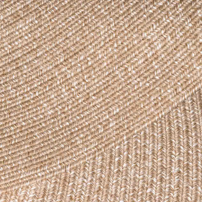Extreme close-up of a light-brown rug, showing detailed pattern, ideal for outdoor furniture settings.