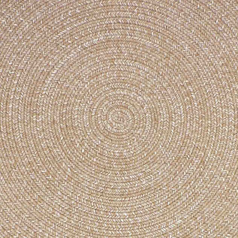 Close-up of a light-brown round rug, showcasing the circular pattern, perfect for complementing outdoor furniture.