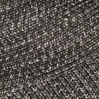 Extreme close-up of a black rug, revealing detailed pattern, ideal for outdoor furniture setups.