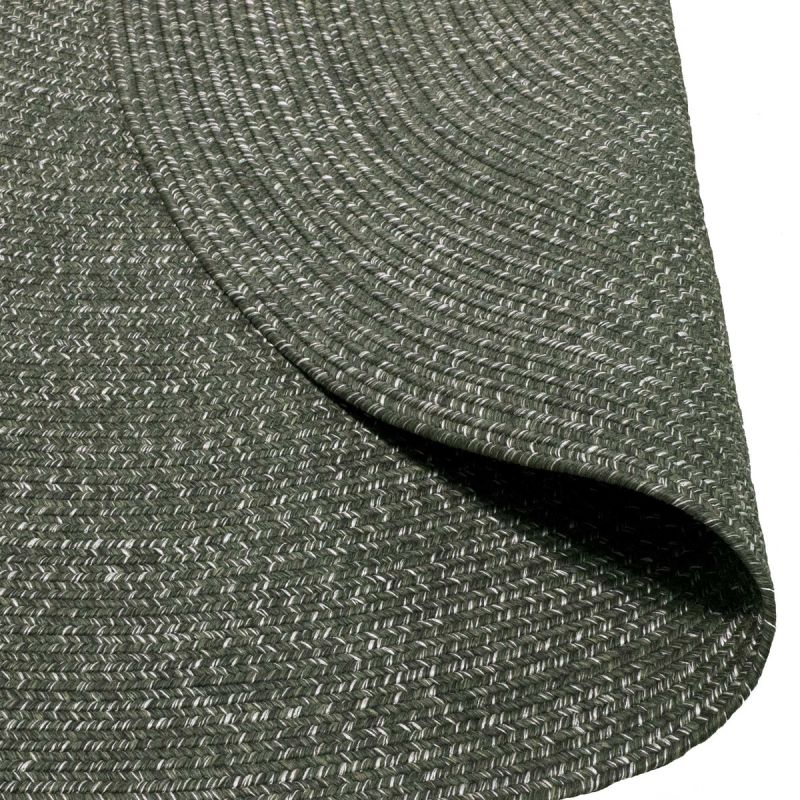 Dark-grey rug, partially folded, set against a plain white background, designed for outdoor furniture areas.