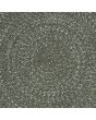 Close-up of a dark-grey round rug, showcasing the circular pattern, ideal for outdoor furniture spaces.
