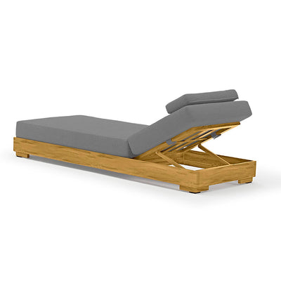 Grey & brown aluminium 'Skyline' outdoor sun lounger displayed on a plain white background, viewed from a back angle. The sun lounger features the head part slightly elevated, providing a comfortable reclining position, perfect for lounging or reading.