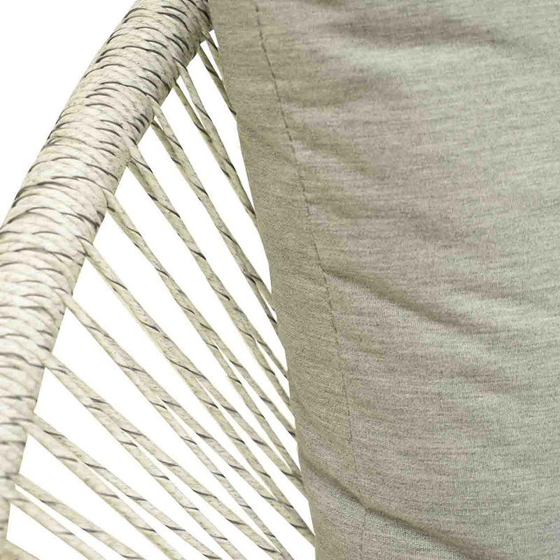 Close up on the wicker design & upholstery of a white & grey wicker outdoor wicker lounge from the &