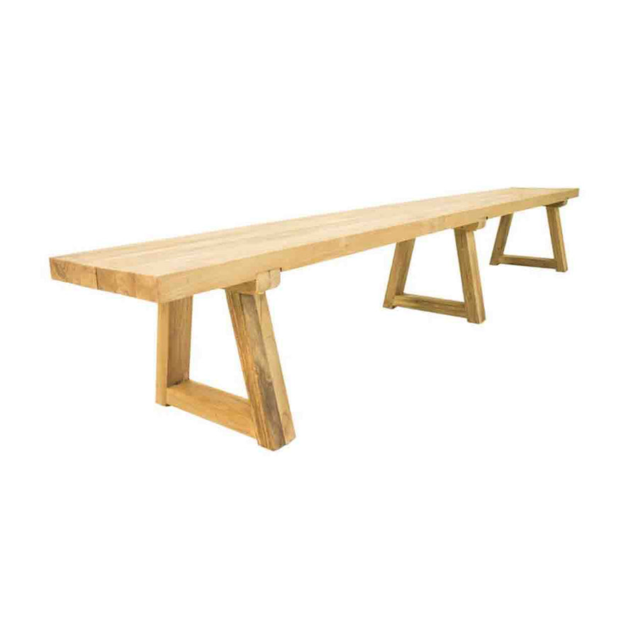A 300 cm long golden-brown outdoor bench made of recycled teak is supported by 3 sets of sturdy wooden trapezoid legs and displayed on a plain white background, viewed from a side angle.