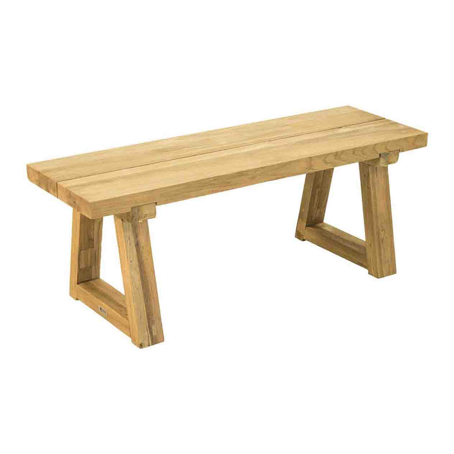 A small 140 cm golden-brown outdoor bench made of recycled teak is supported by 2 sturdy wooden trapezoid legs and displayed on a plain white background, viewed from a front angle.
