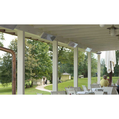 A group of Heatscope Outdoor Vision 3200W heaters providing warmth in an outdoor dining area at a golf club, surrounded by lush greenery for an elevated outdoor living experience.