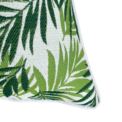 Close-up on the corner of a floral green & white Amazon-inspired outdoor scatter cushion, perfect for outdoor furniture setups.