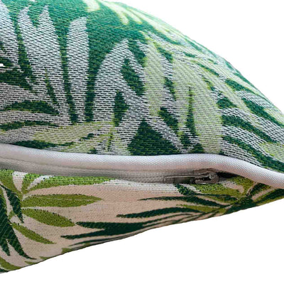 Close-up on the corner of a floral green & white Amazon-inspired outdoor scatter cushion, perfect for outdoor furniture setups.