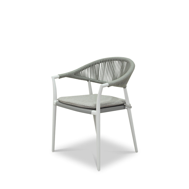 A close up of a rope dining chair with white frame and light grey fabric set against a white background. Outdoor furniture, outdoor dining furniture, Windsor Dining Chair.