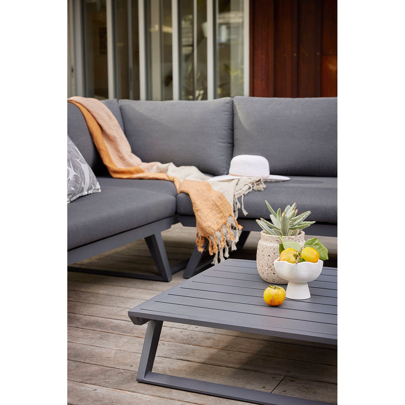 Aluminum outdoor furniture from Yarra Sofa Series, including an outdoor lounge chair, with a cat on a side table, designed to withstand Aussie UVs.