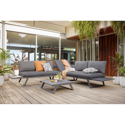 Aluminum outdoor furniture from Yarra Sofa Series on a patio with a couch, coffee table, potted plants, and outdoor lounge chair.