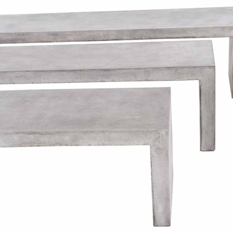 A close-up of 3 minimalist, sturdy concrete benches arranged in a row from smallest to largest, perfect for outdoor concrete seating, displayed on a plain white background and viewed from the front.