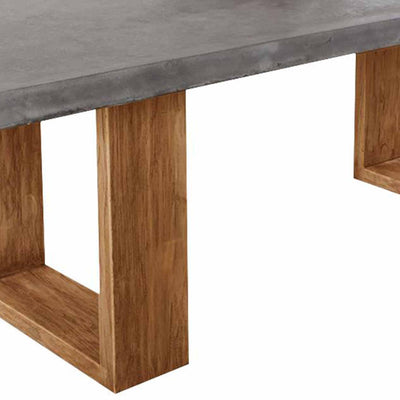 Zen concrete table with customizable Teak or metal legs, perfect for outdoor furniture settings.