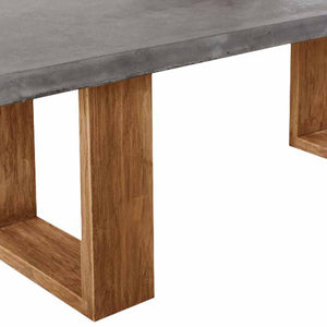 Zen concrete table with customizable Teak or metal legs, perfect for outdoor furniture settings.