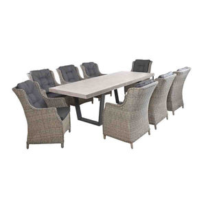 Zen aluminium-framed outdoor dining table with a concrete GFRC tabletop, surrounded by 8 Darwin wicker wave chairs, all set against a plain white background.