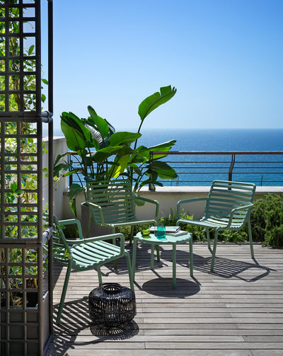 Designer Raffaello Galiotto's Doga Range outdoor furniture set, featuring a concrete table and recyclable resin chairs.