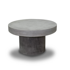 Zen round outdoor concrete coffee table, 66 cm, set on a plain white background. The coffee table has a dark-grey weathered cement colour.