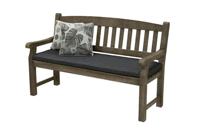 A 150cm dark brown wooden outdoor bench with a dark grey fade-resistant seat cushion & 2 light-coloured decorative throw pillows. The bench is made of high-quality acacia wood, and perfect for any outdoor setting. It is displayed on a plain white background, viewed from a front angle.