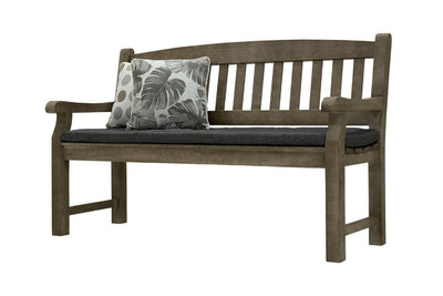 A 150cm dark brown wooden outdoor bench with a dark grey fade-resistant seat cushion & 2 light-coloured decorative throw pillows. The bench is made of high-quality acacia wood, and perfect for any outdoor setting. It is displayed on a plain white background, viewed from a front angle.