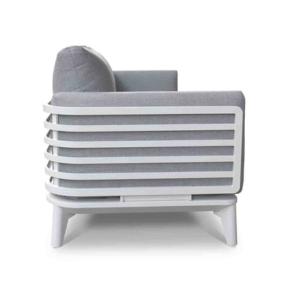 Alora range aluminum outdoor furniture, featuring a gray and white striped outdoor lounge chair with pillows, designed for durability and comfort.
